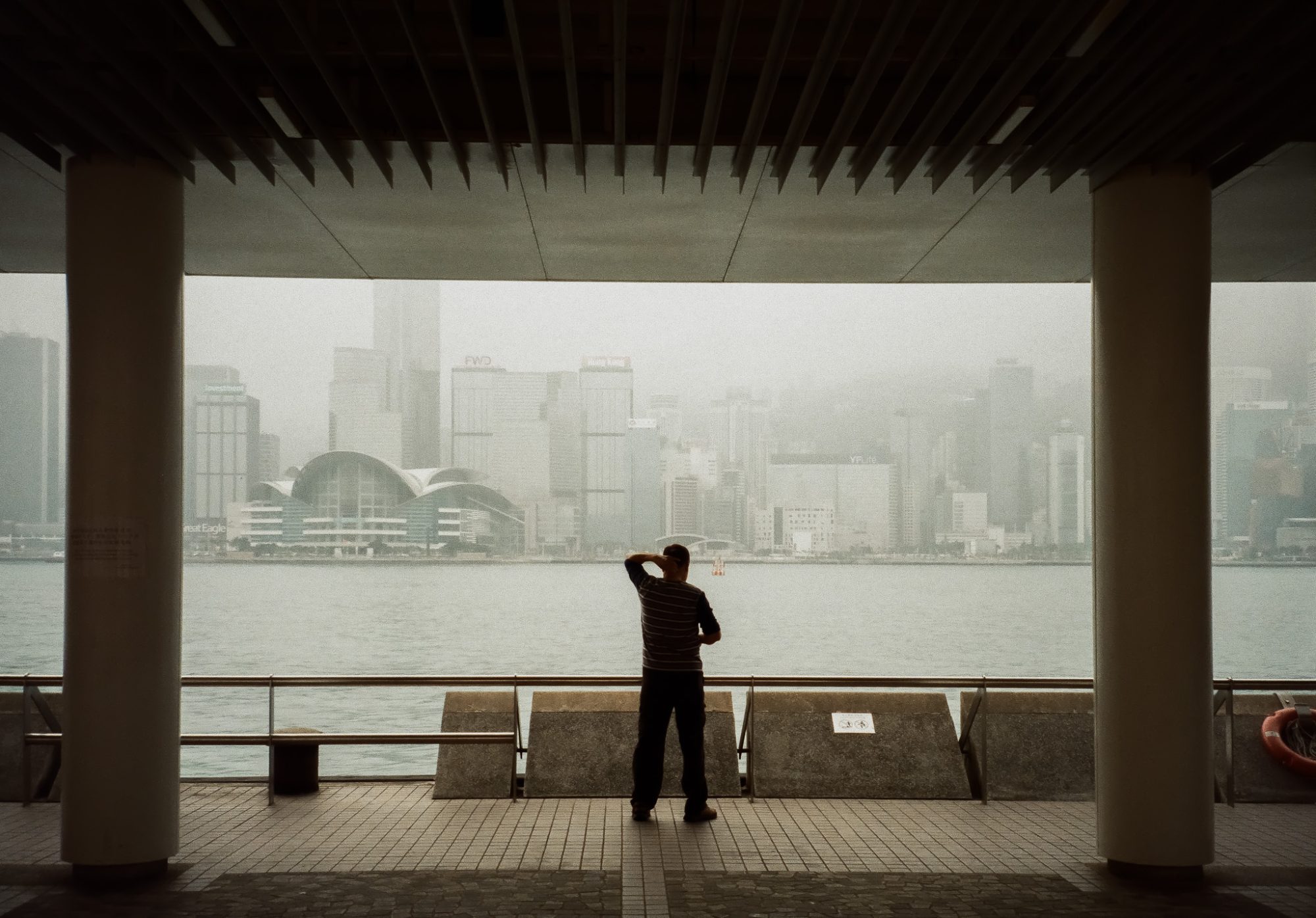 A man looking across the harbour