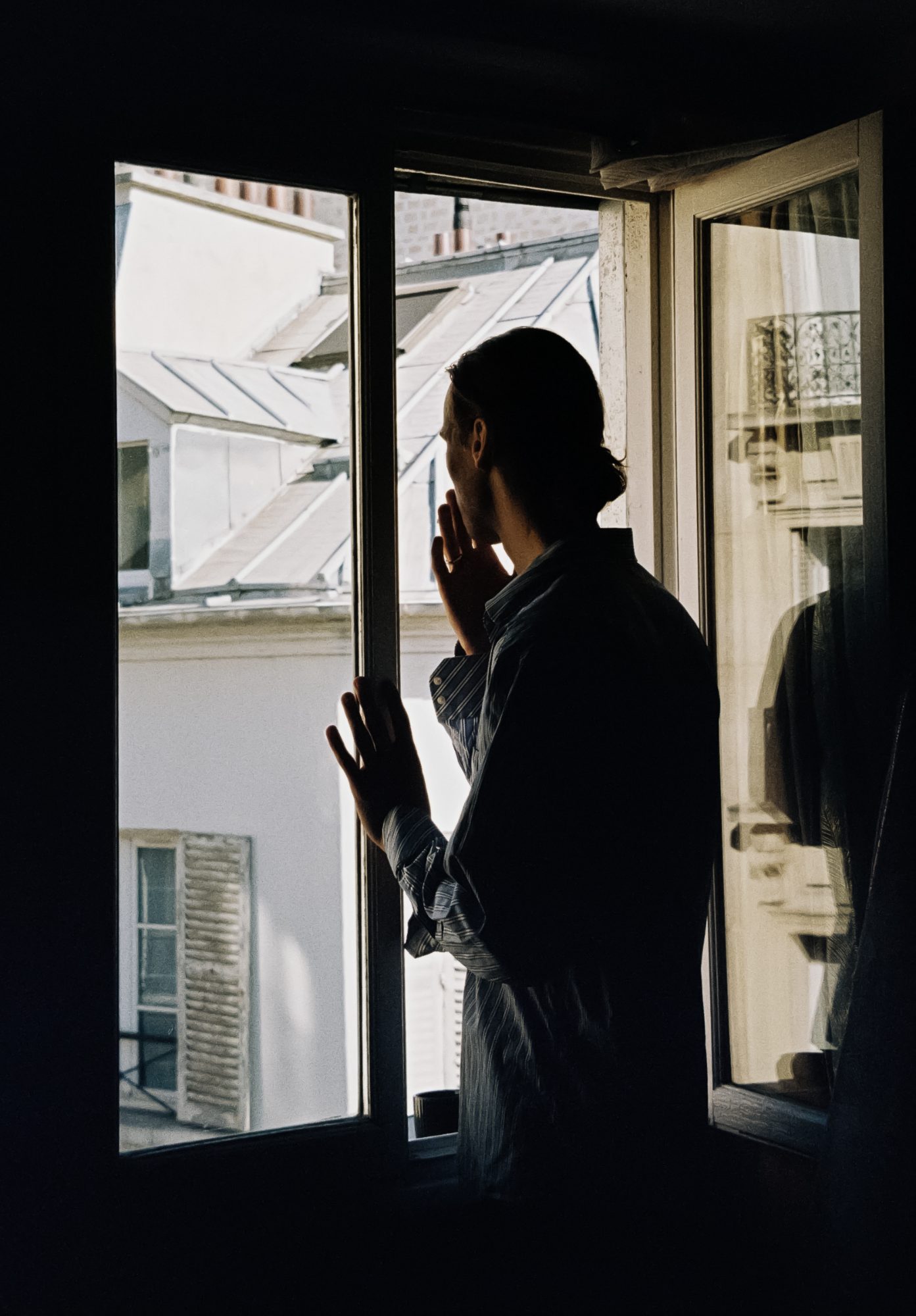 At the window, cigarette